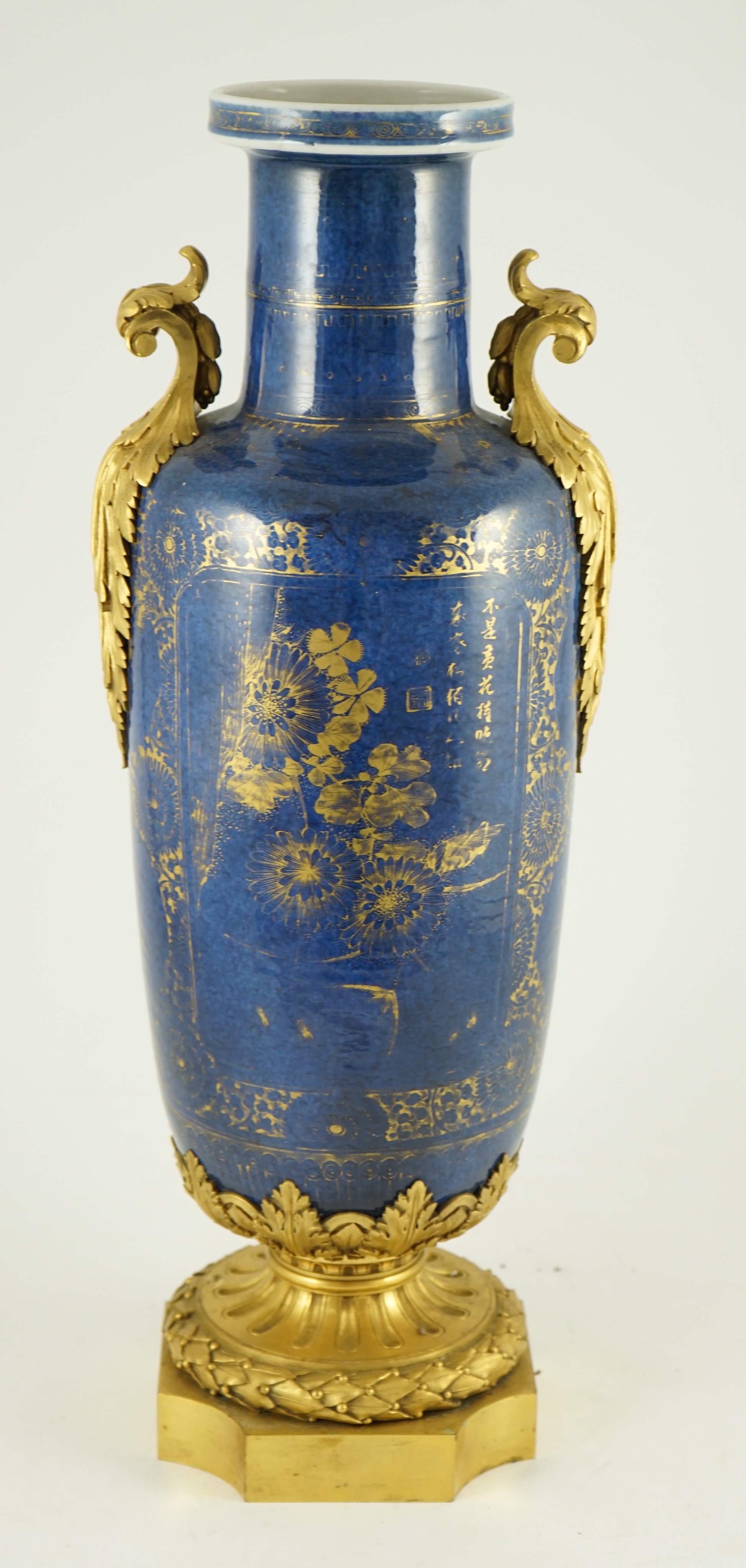 A Chinese gilt-decorated powder blue rouleau vase, Kangxi period, with French ormolu mounts, 55 cm high including ormolu mounts